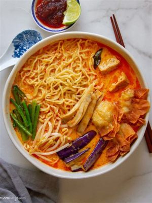  Laksa Penang: Une symphonie épicée de saveurs malaisiennes et de textures crémeuses !